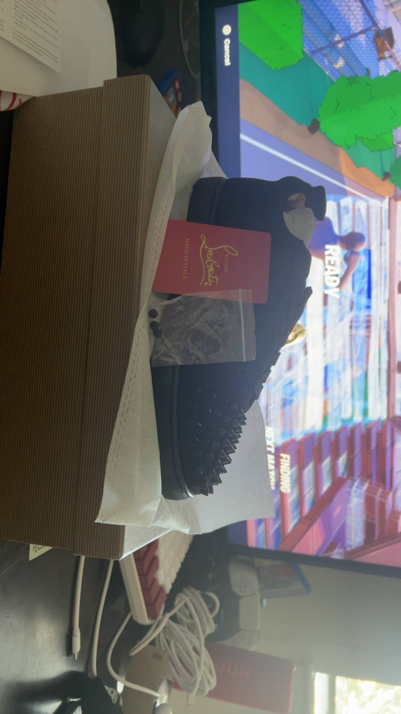 Christian Louboutin Black High-Top Sneaker with Gold Trim
