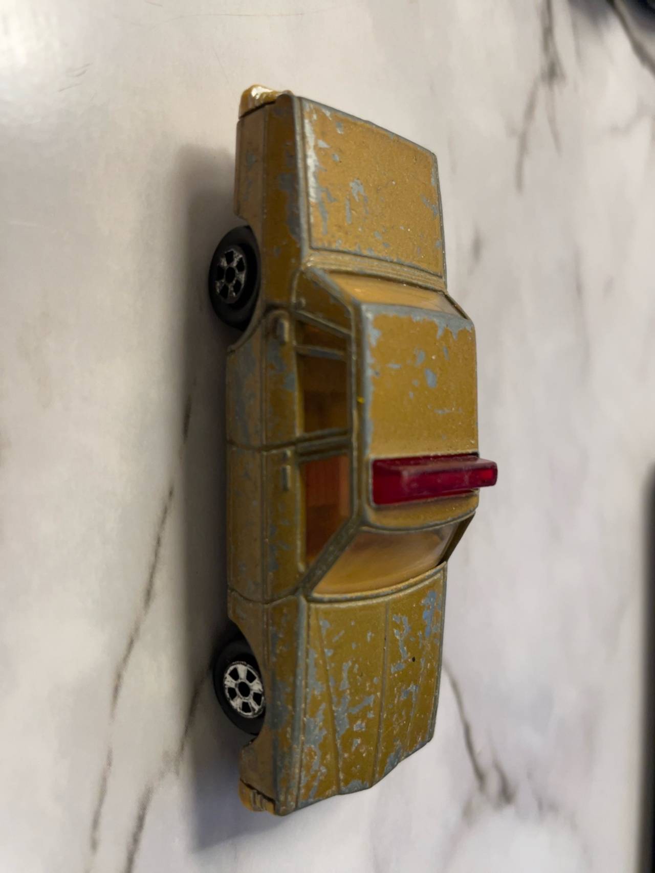 Hot Wheels Cadillac Seville Gold Diecast Car
