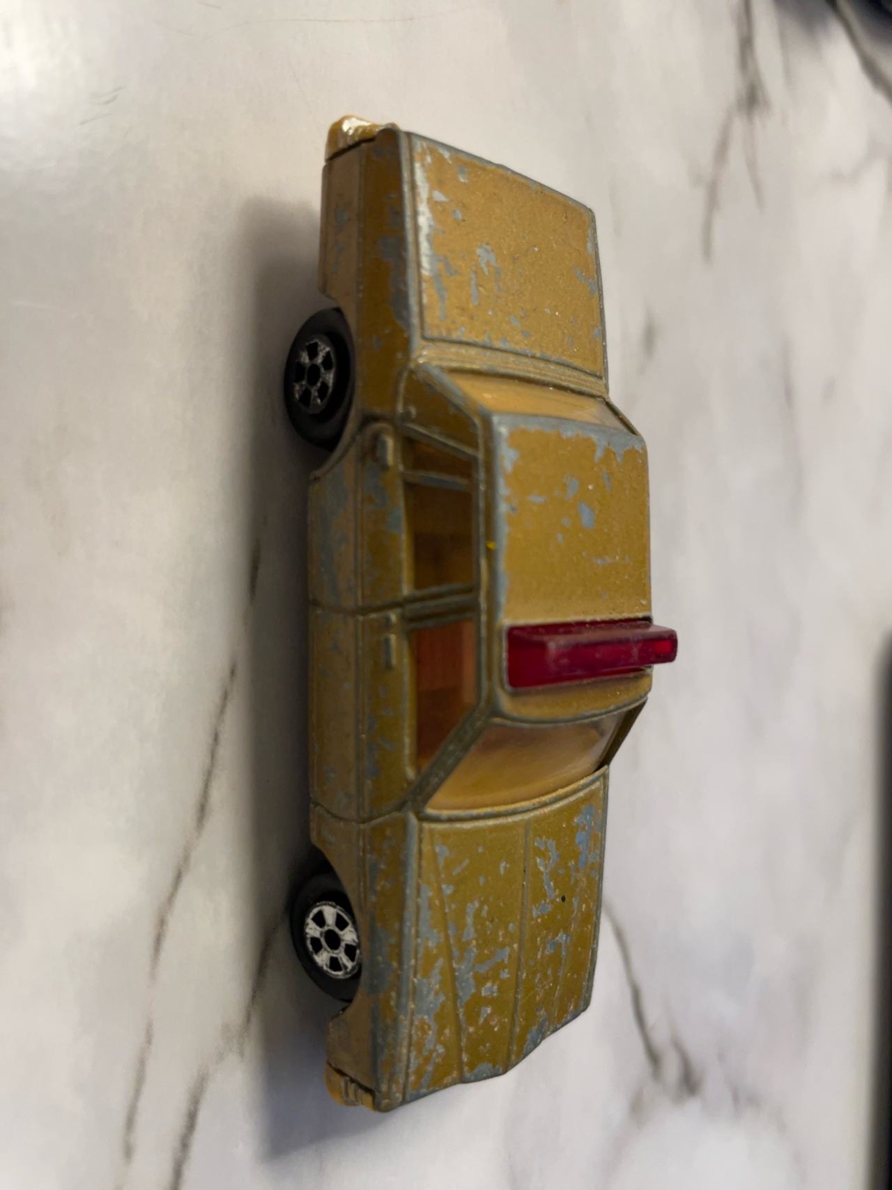 Hot Wheels Cadillac Seville Gold Diecast Car