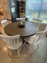 Living Spaces Round Wooden Dining Table with White Spindle Back Chairs - Image 3