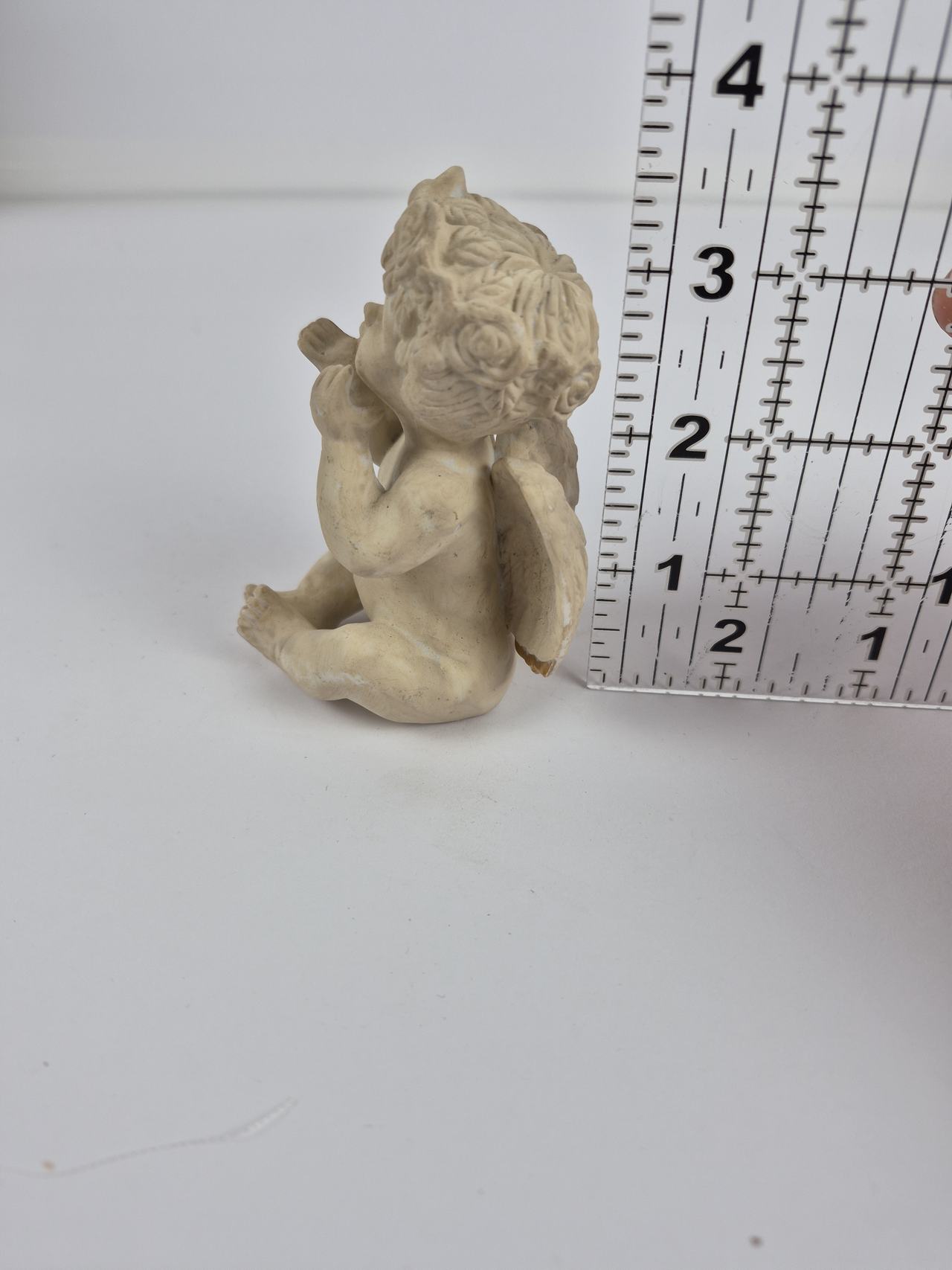 Seated Cherub Blowing a Kiss Figurine