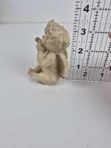 Seated Cherub Blowing a Kiss Figurine - Image 1