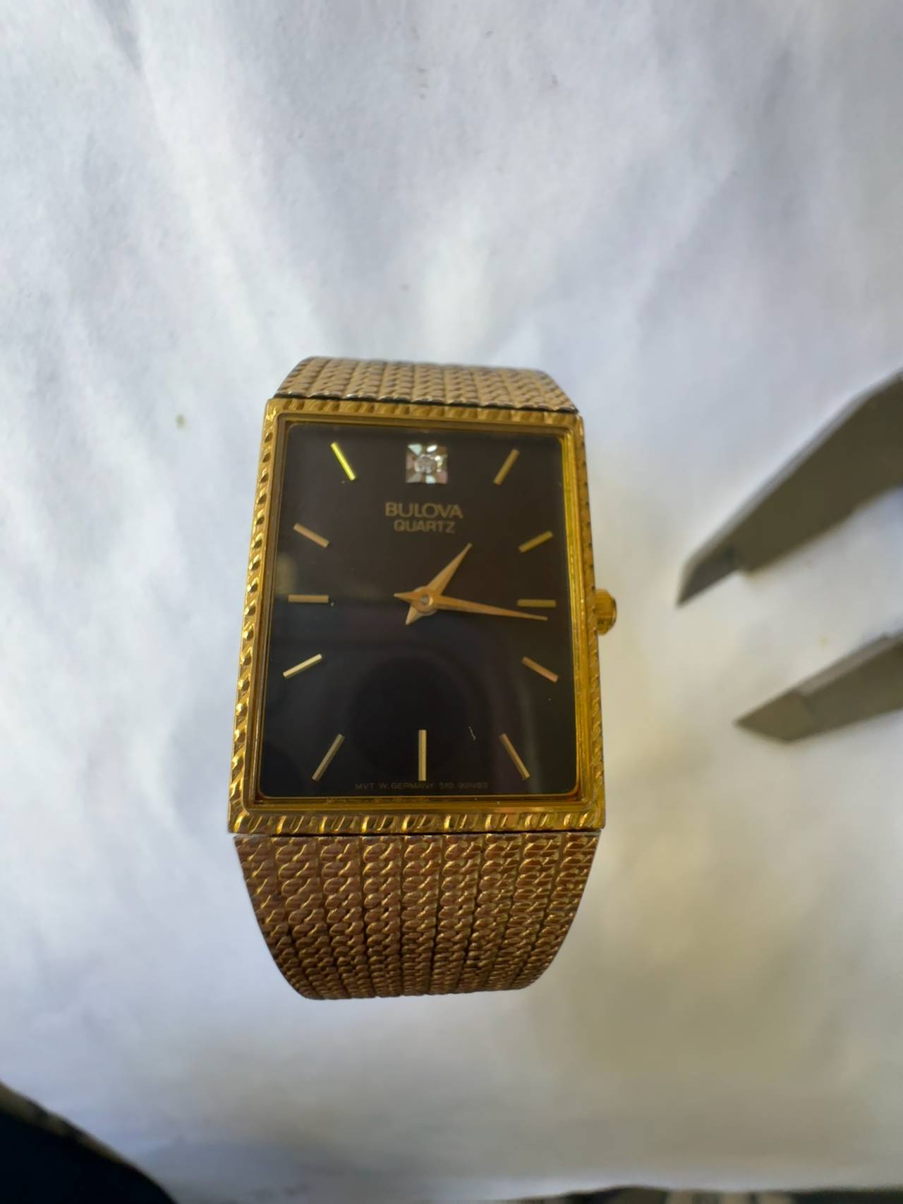 Bulova Vintage Gold Tone Tank Watch with Black Dial and Diamond Accent