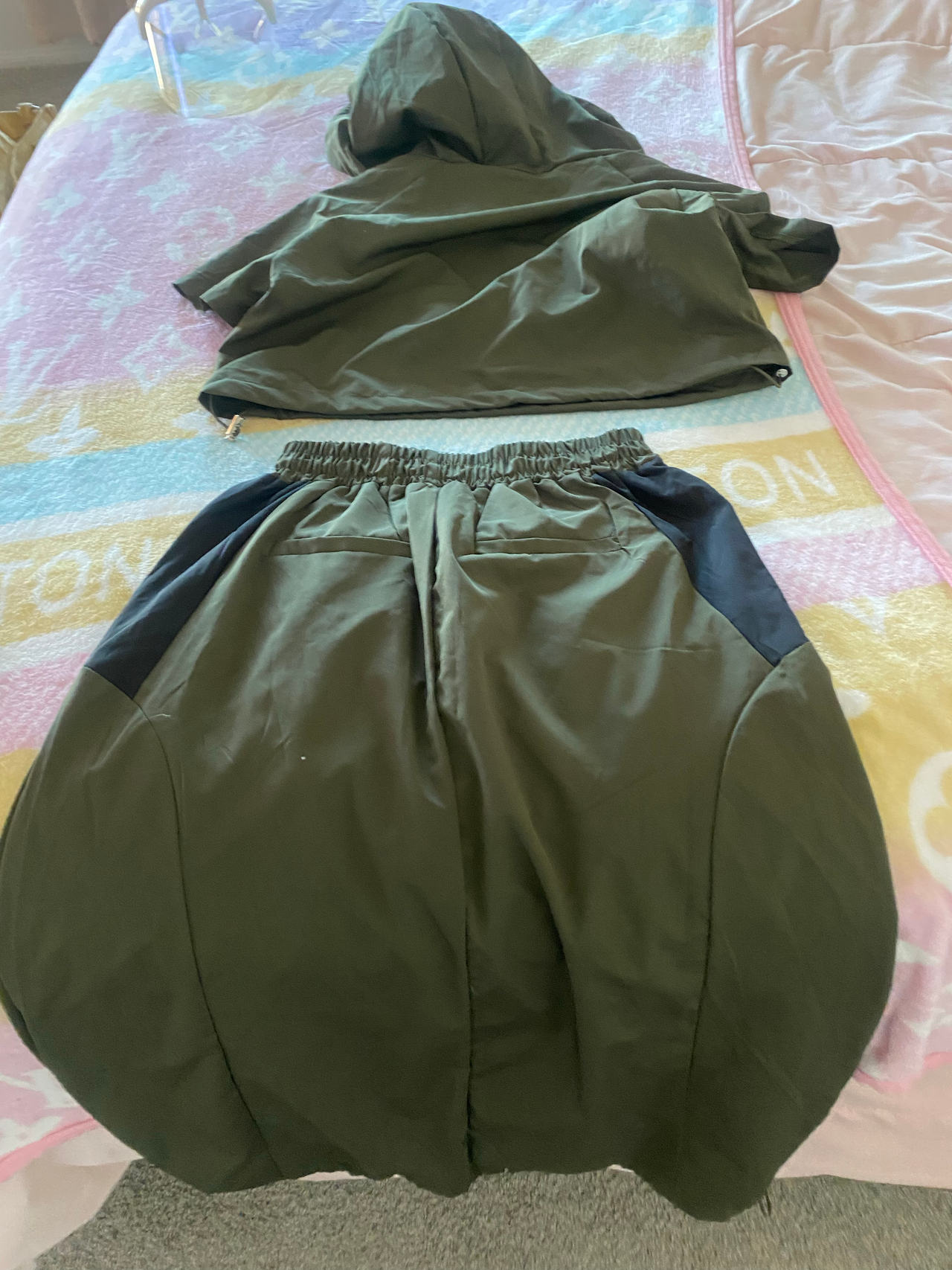 Two-piece skirt, string on skirt so you can adjust. Hooded top
