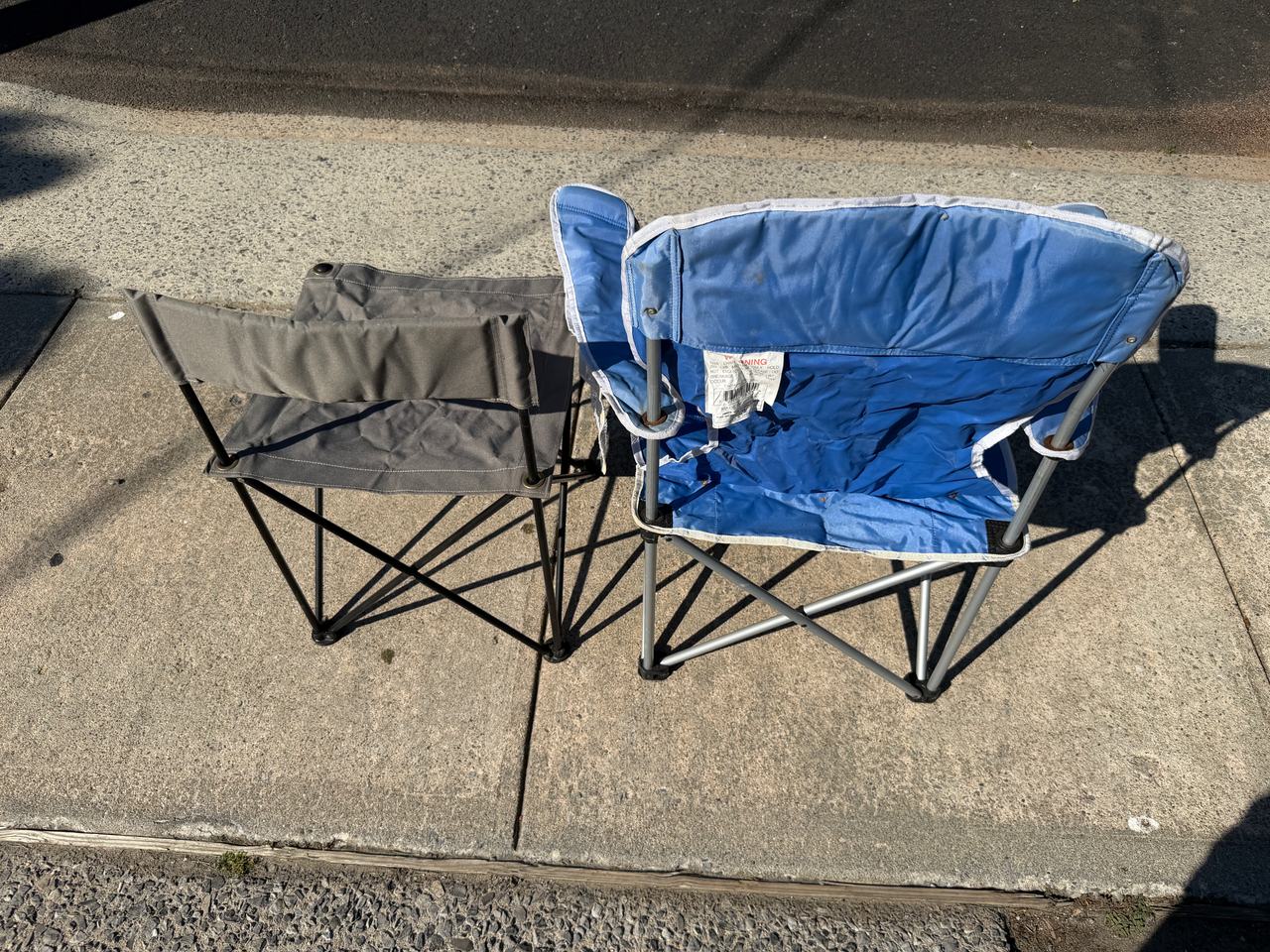 Lot of two folding chair. Blue generic one and ford explorer chair