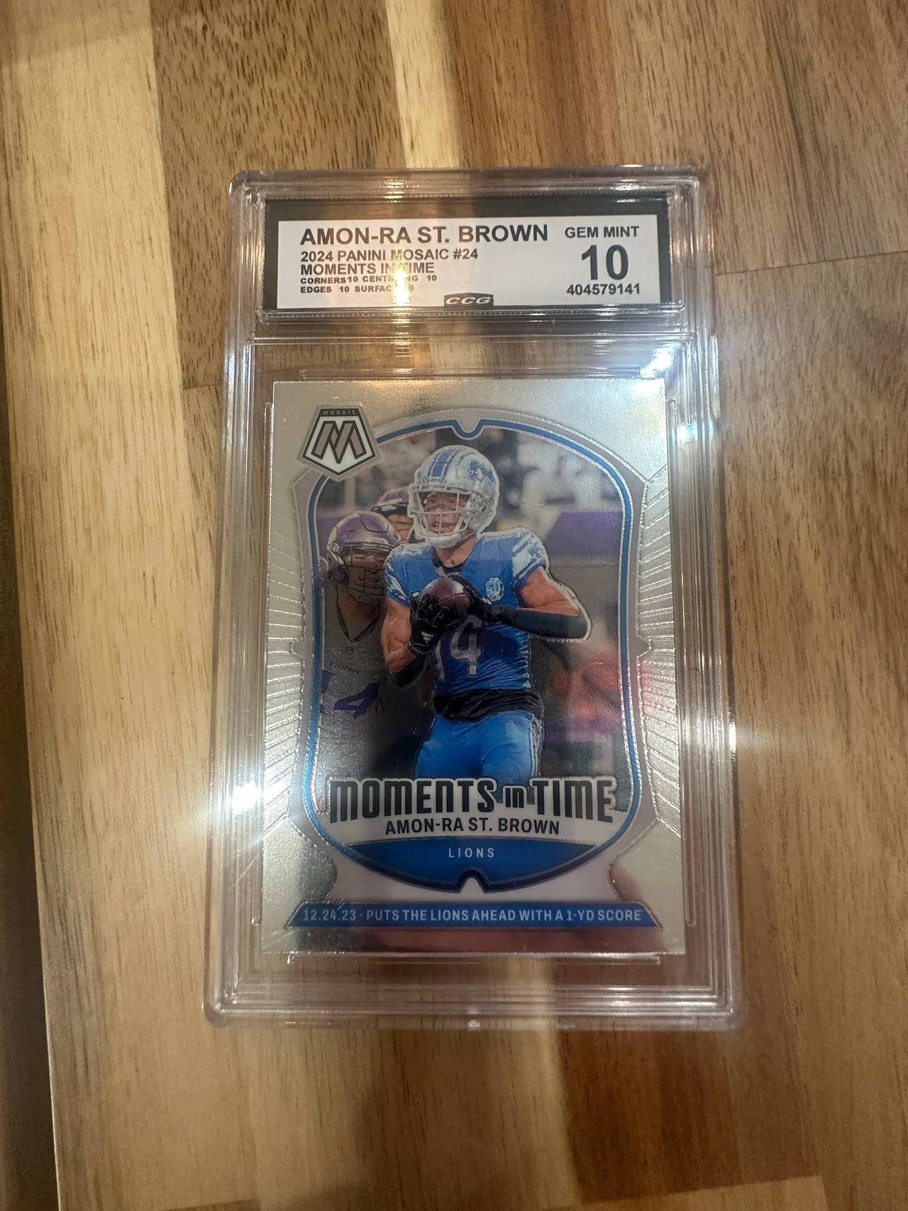 2024 Panini Mosaic Amon-Ra St. Brown Moments In Time #24 CCG 10
