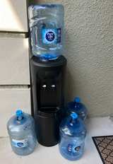 Water Dispenser 4 Empty 5 Gallon Bottles  - Image 1