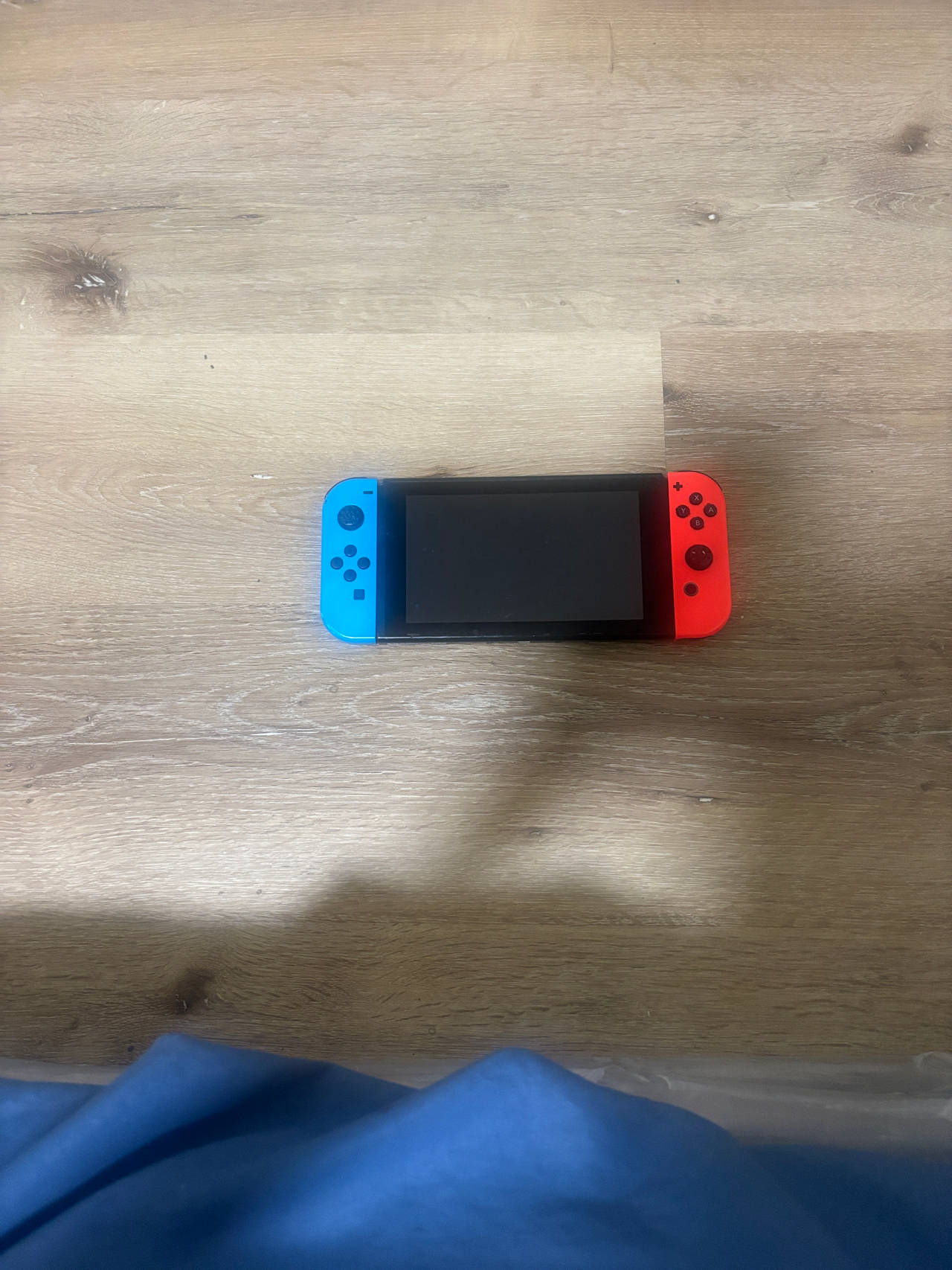 Nintendo Switch with Neon Blue and Neon Red Joy-Con