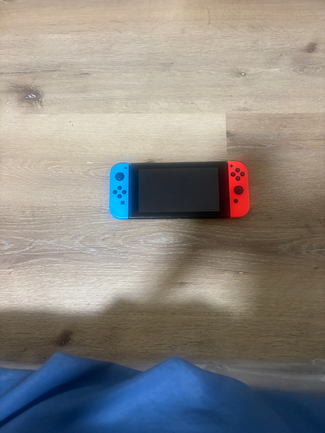 Nintendo Switch with Neon Blue and Neon Red Joy-Con