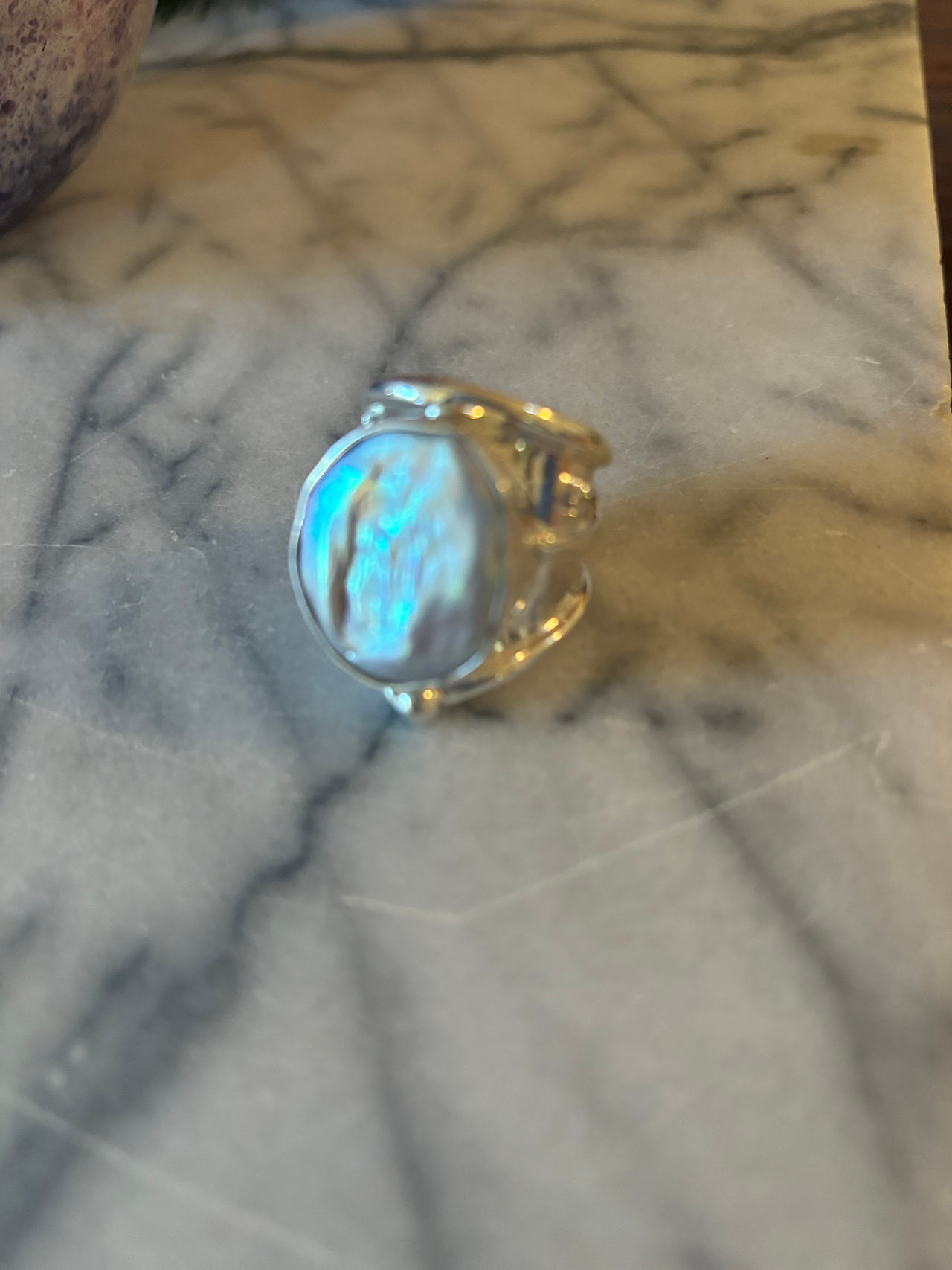 Beautiful pearl and sterling silver handcrafted ring , heavy with two cubic zirc