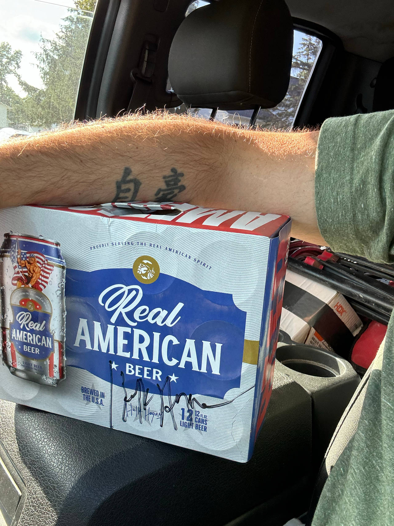 Real American Beer 12-Pack Cans Signed by Hulk Hogan