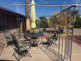 Metal Patio Dining Set with Cushions and Umbrella - Image 1