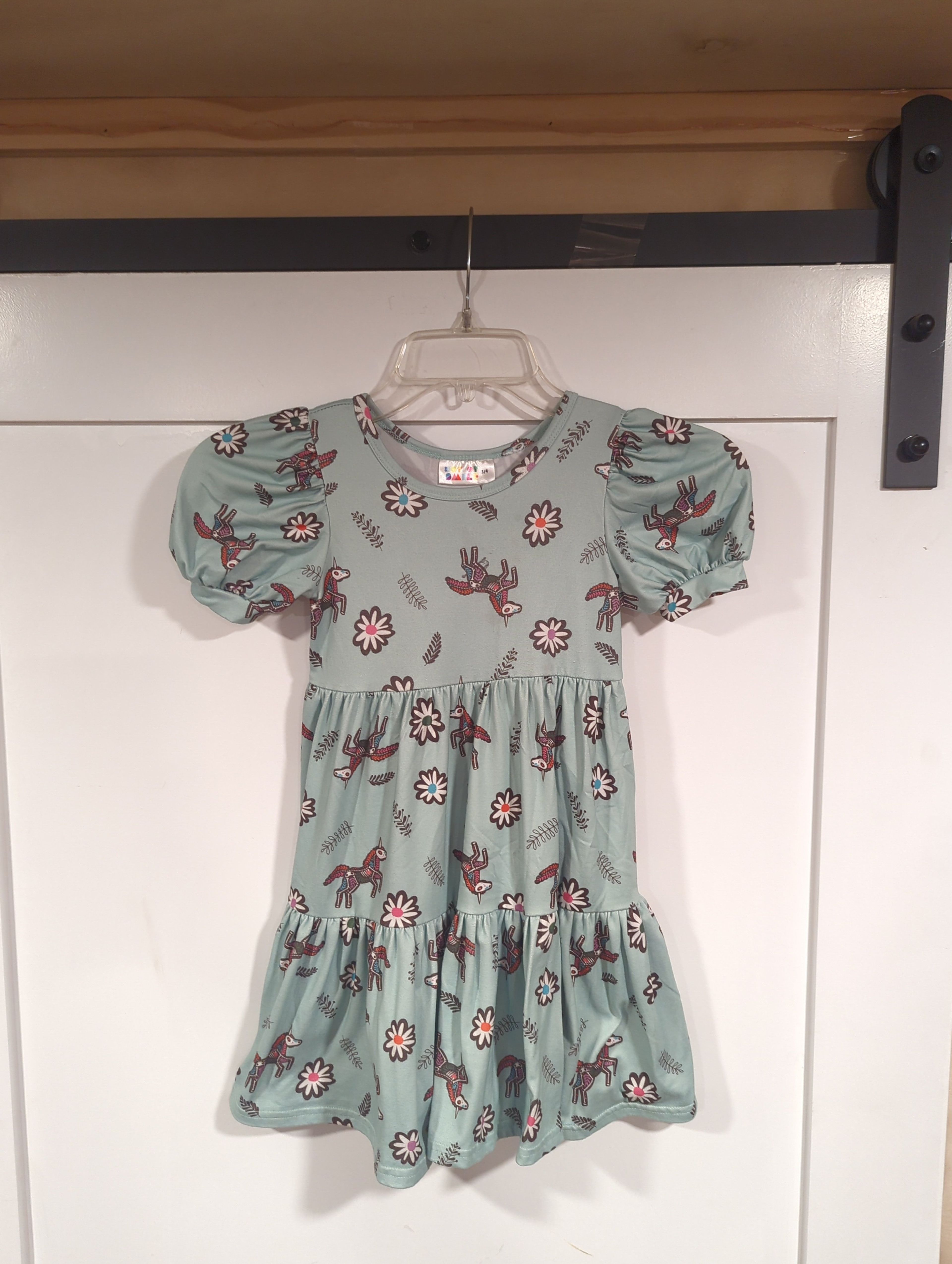 DotDotSmile Tiered Dress. unicorn skeleton