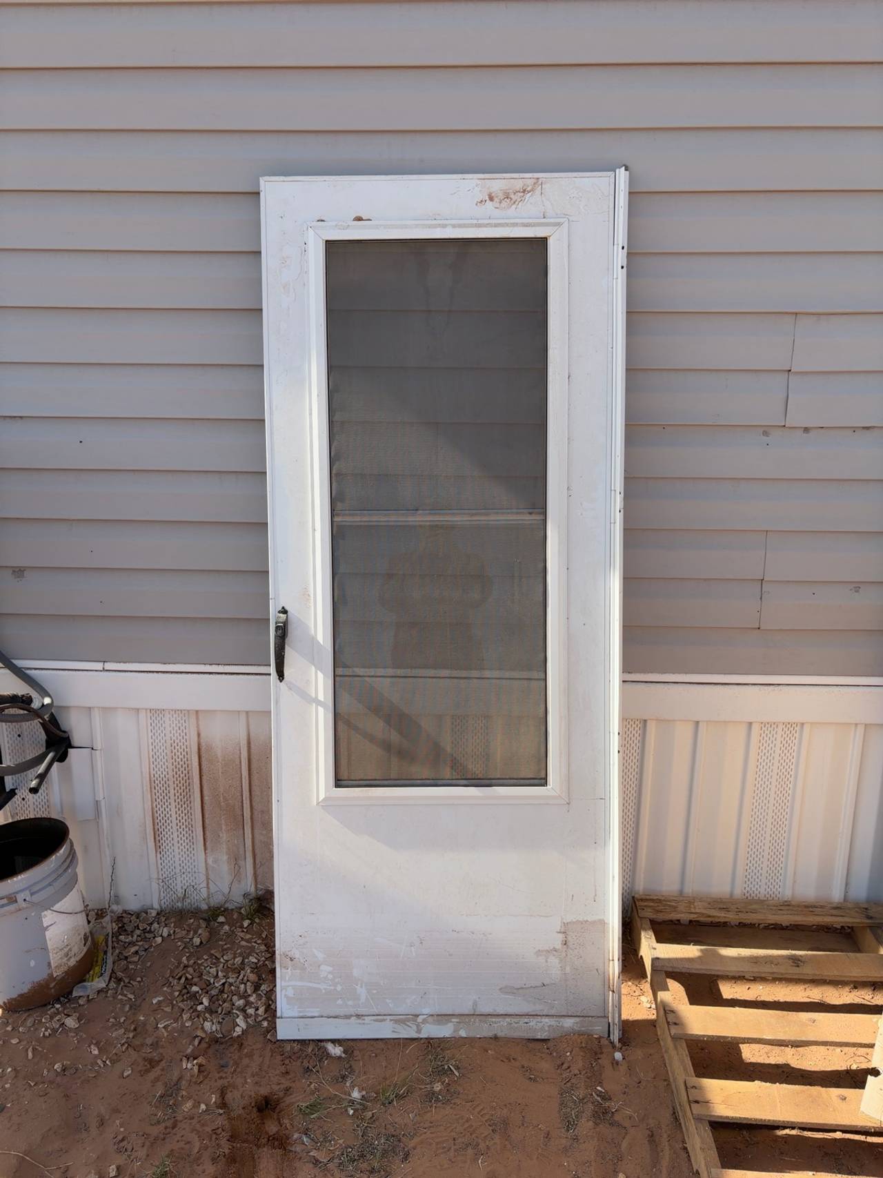 EMCO 200 Series White Triple-Track Storm Door with Black Hardware