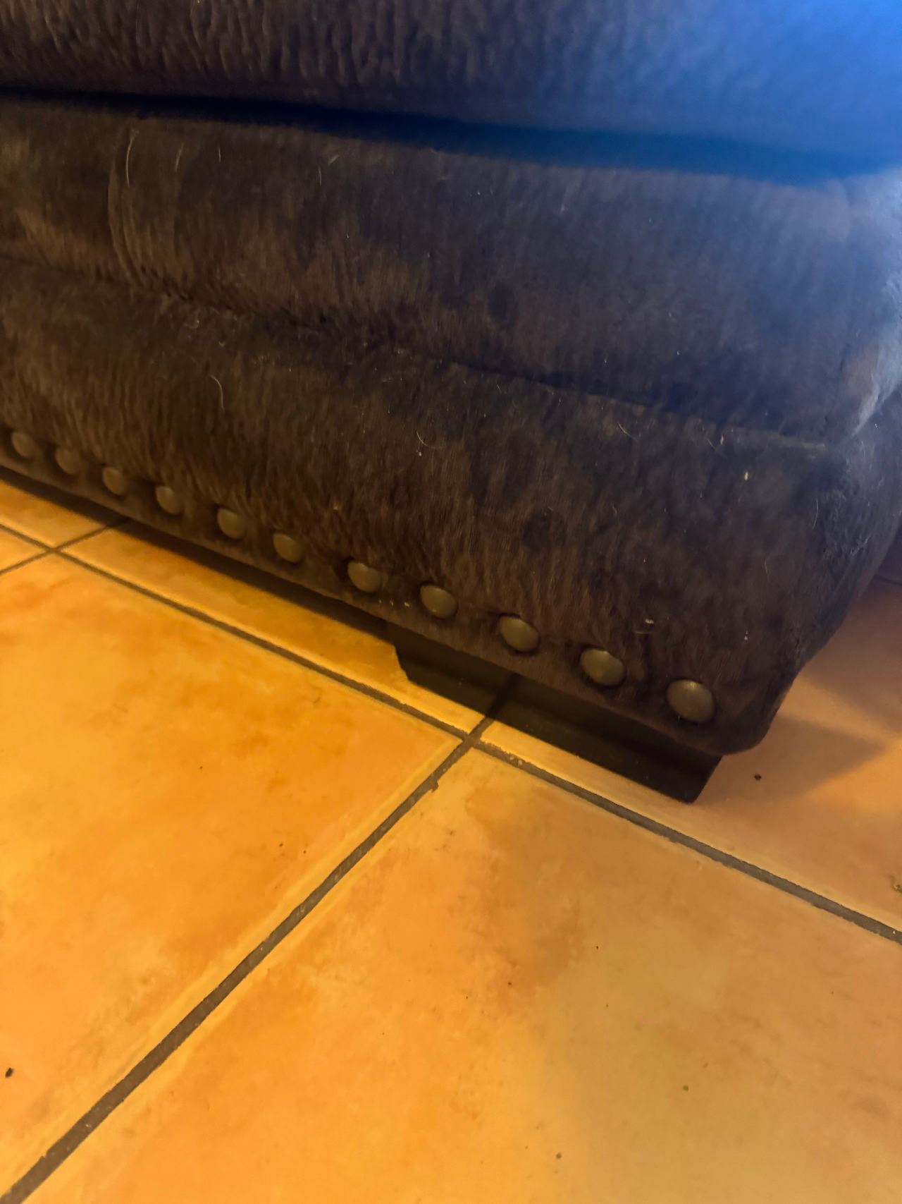 Upholstered Ottoman with Nailhead Trim