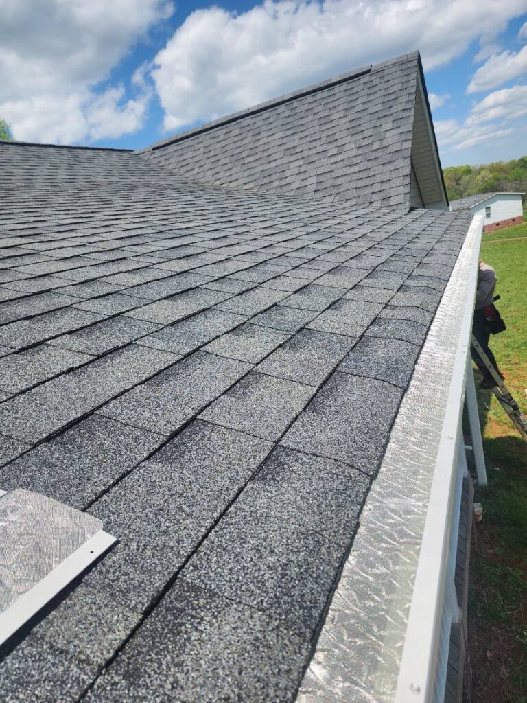 Installing gutter protection.