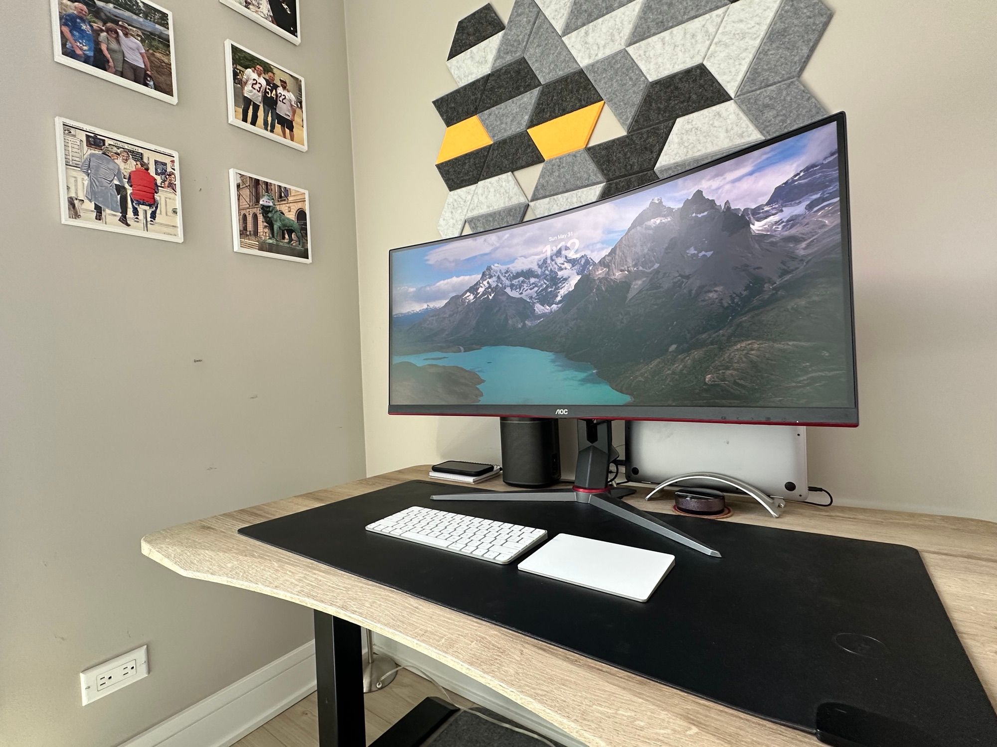 The desk and the wall of photos