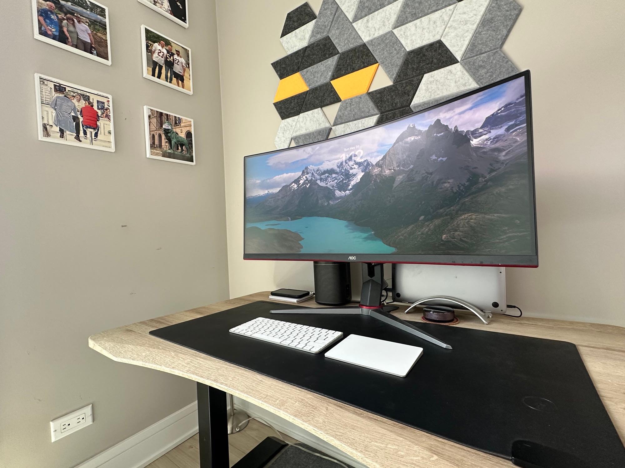The desk and the wall of photos