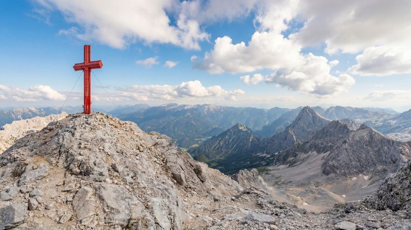 The red iron cross on the iconic summit of Großer Priel, the highest mountain on Austria's Dead Ridge Trail.