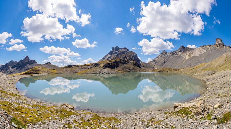 Like a landscape from another planet, Lac de la Forcla, at an altitude of 2,460 meters, lies along a unique and exceptional section of the Tour des Muverans trek in the Swiss Alps.
