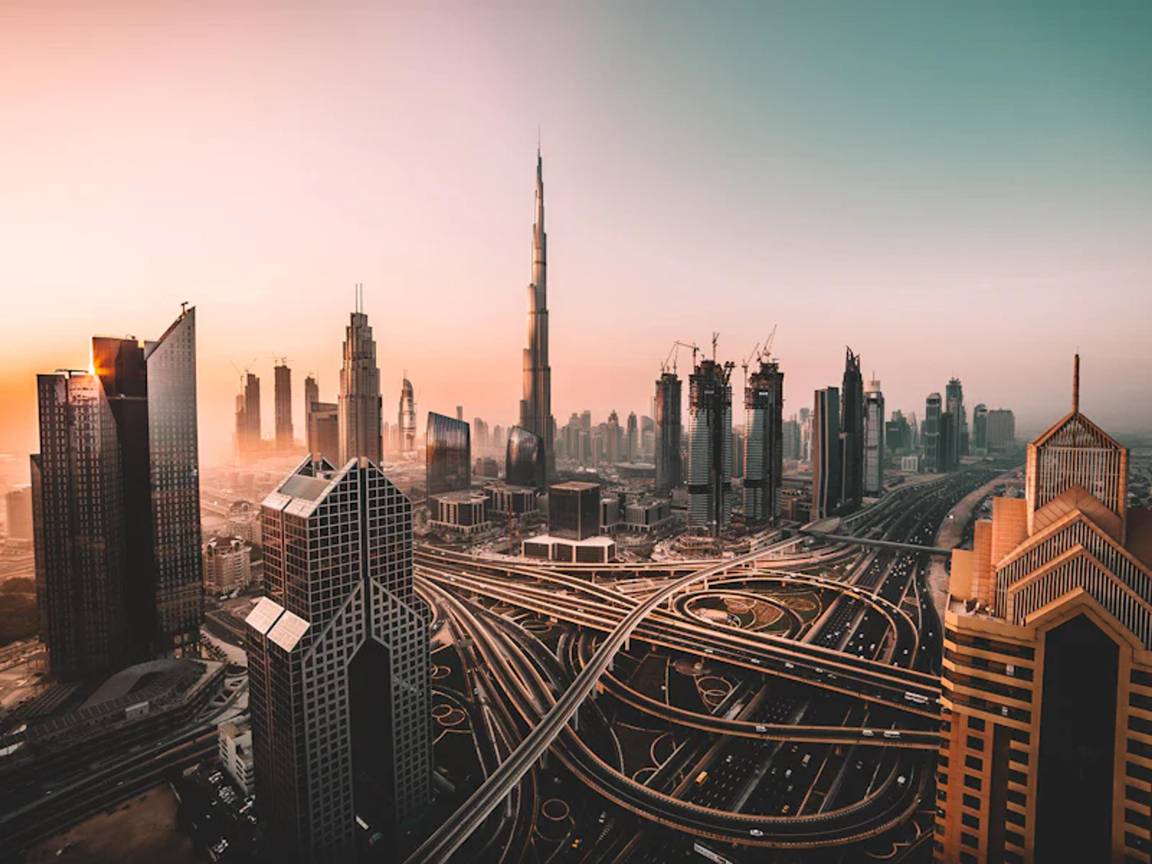 Dubai skyline with Burj Khalifa rising above the city at dusk