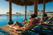 hyatt-ziva-los-cabos-infinity-pool-couple-relaxing