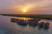 palafitos-overwater-bungalows-aerial-sunset