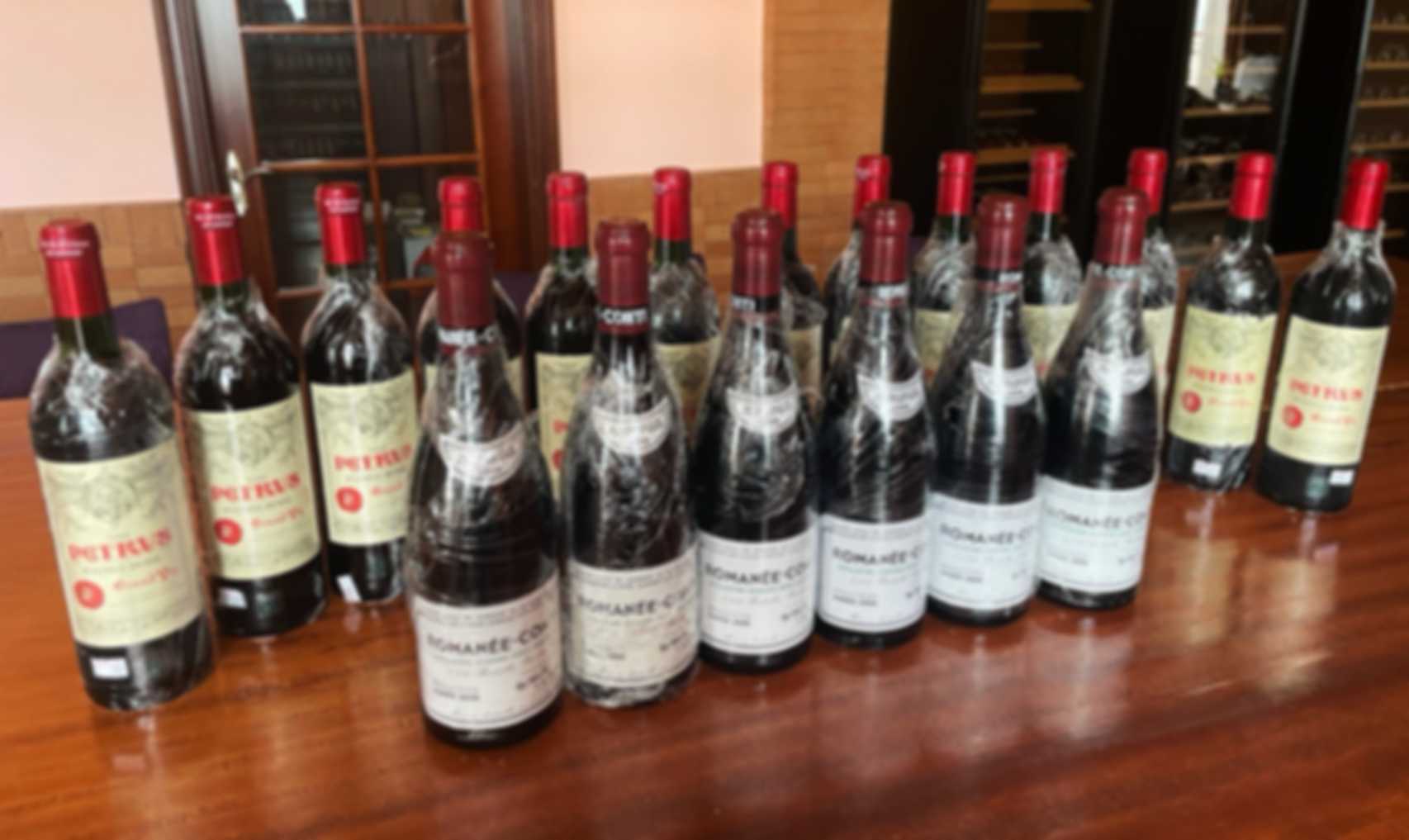 專業酒類回收服務背景圖，展示多款高級酒品