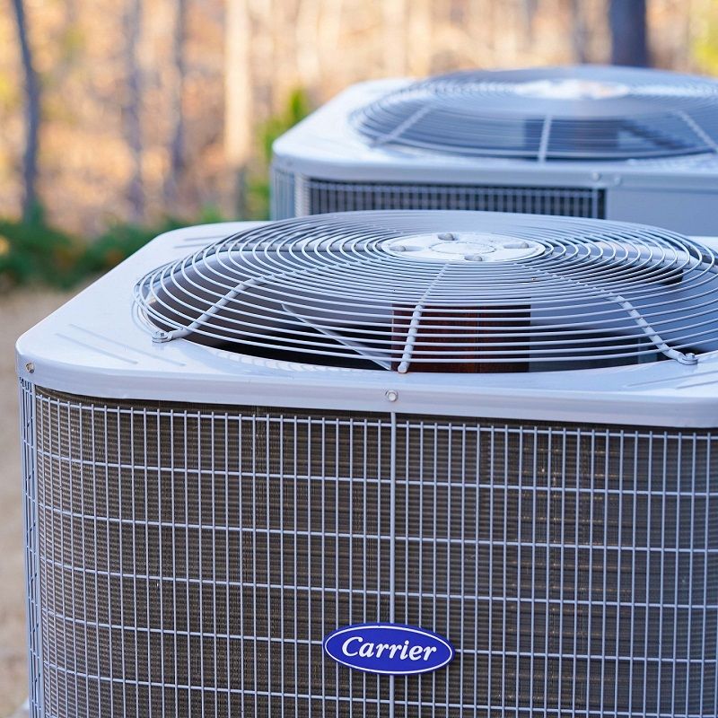 Carrier AC condensers in a backyard in Atlanta