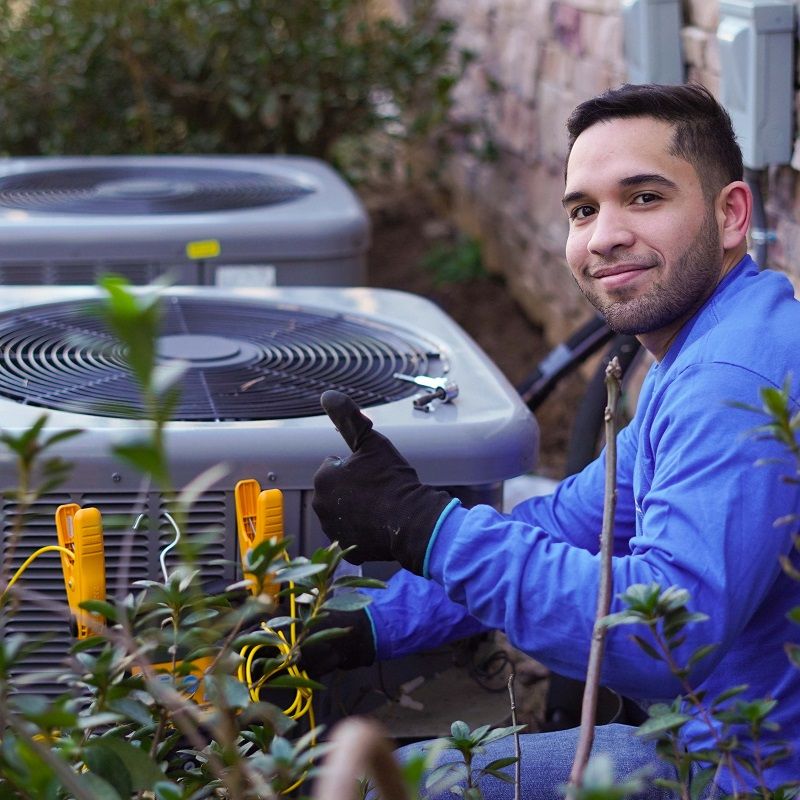 Cool United Air techcnician giving thumbs up to a system