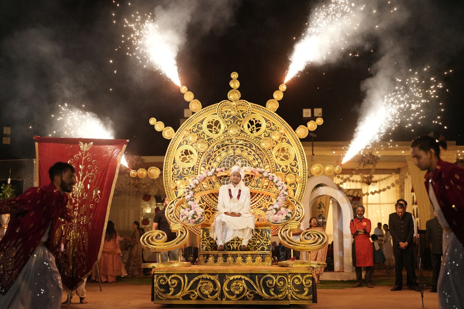 Saloni's entrance on a golden throne, framed by pyros