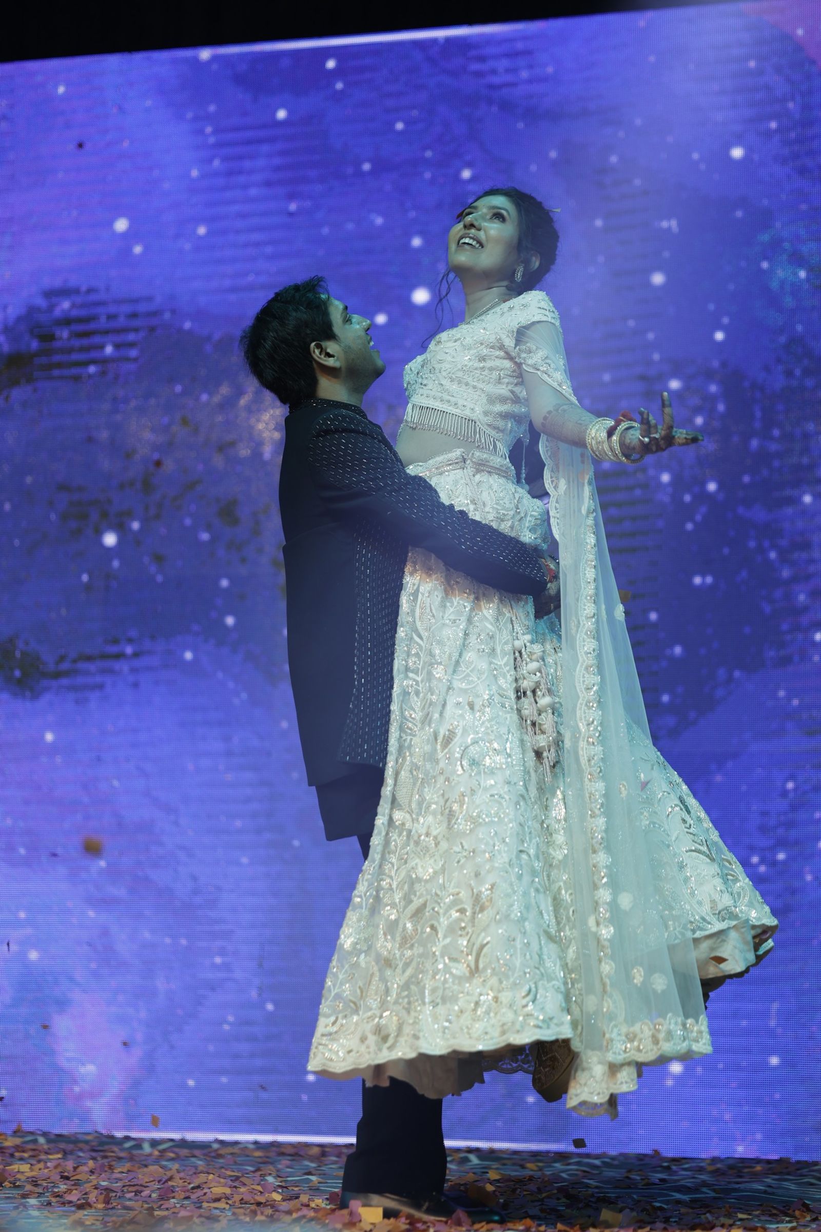 Ravi lifting Saloni during their sangeet dance