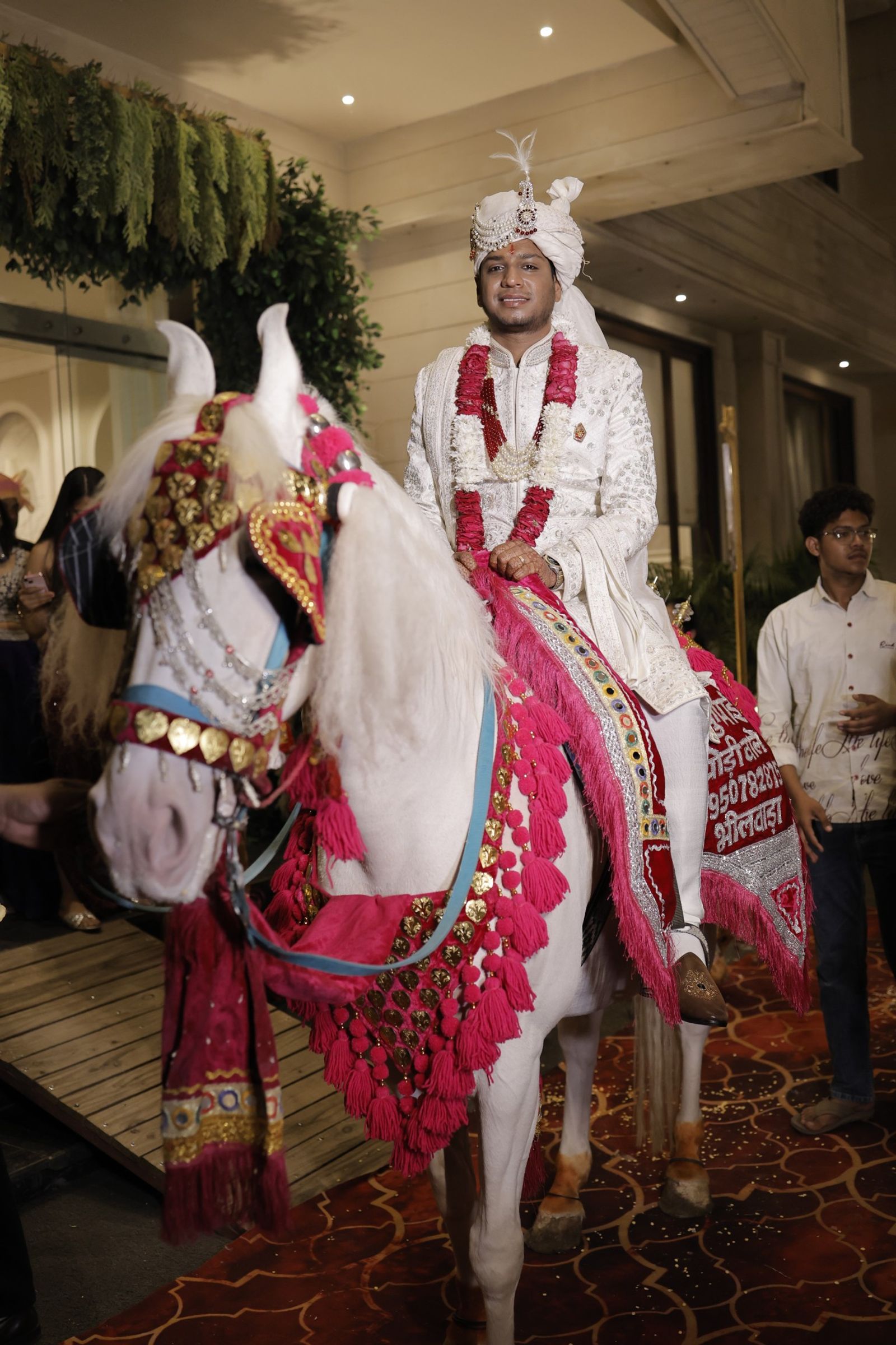 Ravi arriving on a white horse for the baraat