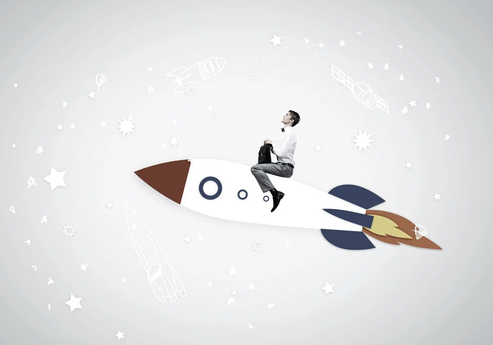 6314-young-businessman-flying-in-sky-on-drawn-rocket.webp