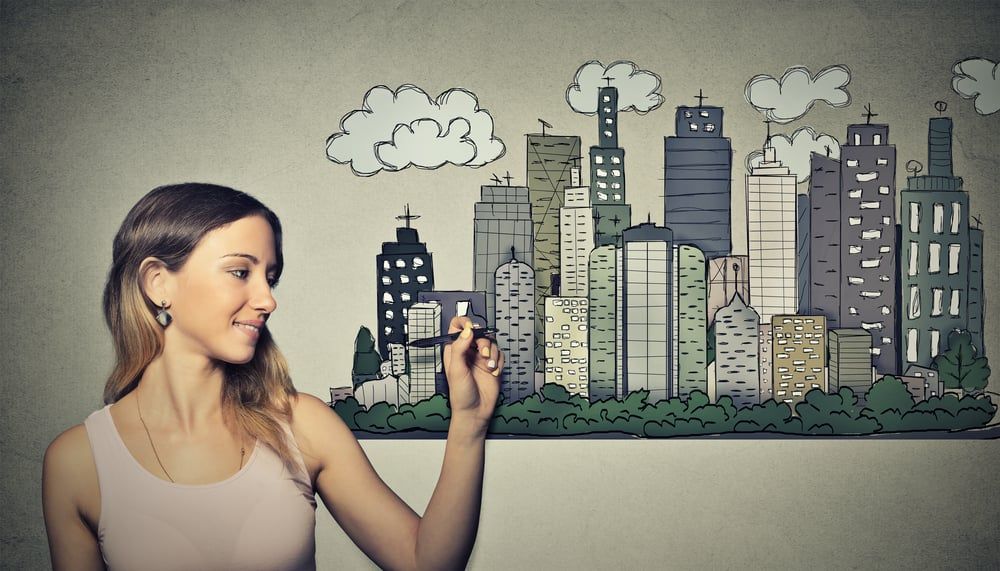 6320-woman-drawing-city-skyline-on-grey-wall-background-real-estate-development-house-market-ec.jpeg