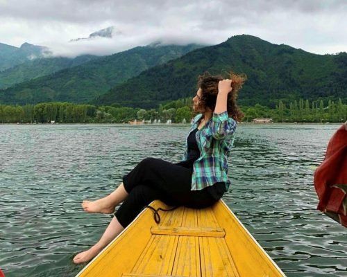 Dal Lake, Kashmir, tourist paradise of Srinagar with clear water, Shikara float, Pir Panjal Mountains