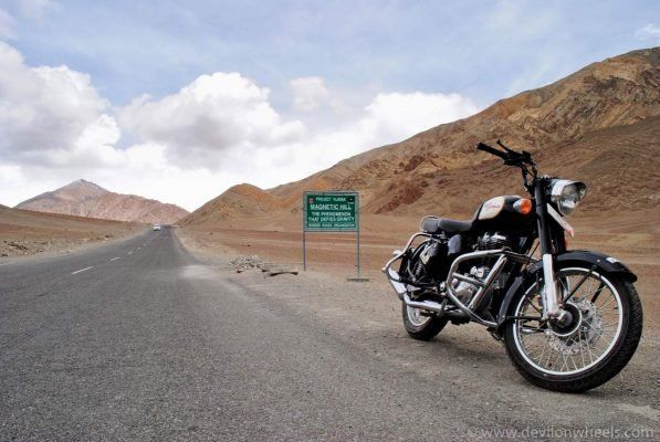 A picture of a motorcycle on the magnetic hill road