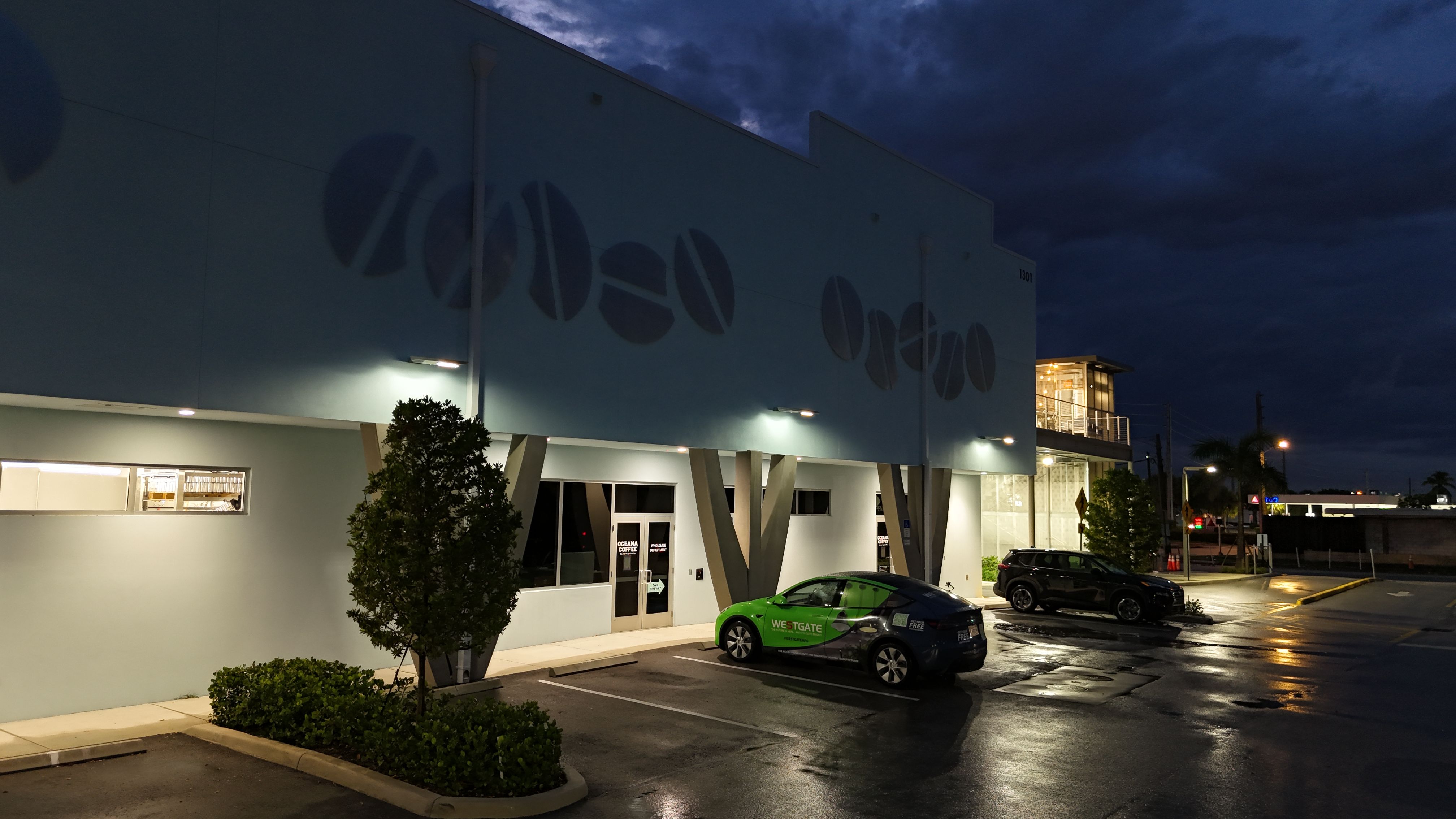 Westgate SOLA-SPLT split solar area light illuminating the parking and walkway areas at Oceana Coffee