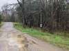 This is the head of Old Road Lane right off of Hiwassee. The private road has a sign on it indicating "dead end." Veer to the right and follow until you see my sign and the rock wall at the front of the driveway on the right.