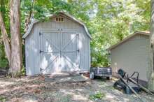 The home also has a storage shed with a riding lawn mower that can stay with the home. 