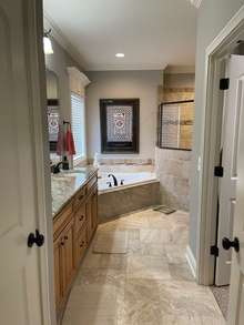 Large Primary Bathroom with Granite and Stone.