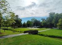 Greenbrook Park is a short walk away, has a huge playground, splash pad, walking path, picnic pavilions and picnic tables.