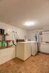 Utility room is located in the basement on your right as you come down the stairs. The rear basement entrance comes in here as well. Plenty of room for washer and dryer and extra storage. 