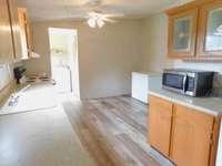 Coffee Station, with microwave - Glass insert in  Cabinets overhead and the Kitchen can Shine once Cleaned and Polished but is fully functional presently