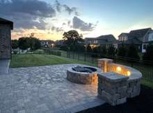 The fire pit has solar lighting that comes on at dusk.