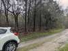 This is a private road not maintained by the county, but taken care of by the neighbors using the road. The other two properties comprising a little over 10 acres are on the left beginning around 70 feet past my car.