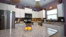 All granite kitchen, 10-year warranty on quality, stainless steel appliances - ALL REMAIN along with the washer and dryer