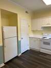 This kitchen is sunny and bright!  One of two refrigerators is shown in this picture.  The other is Stainless and larger. 