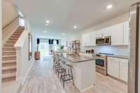 Beautiful open kitchen and living room  *Photos of decorated model home