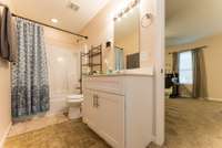 The Full Bath located in the Owner Suite with combo tub/shower and vanity with single sink.